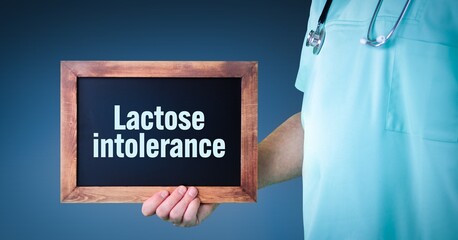 Lactose intolerance. Doctor shows sign/board with wooden frame. Background blue