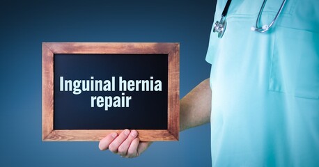 Inguinal hernia repair. Doctor shows sign/board with wooden frame. Background blue