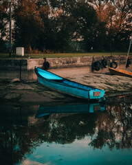 Blue boat and reflection