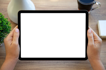 female hands hold computer tablet with isolated screen background table