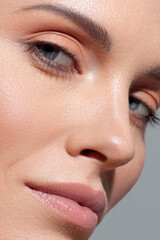 White beautiful woman on gray background