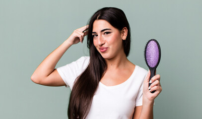 feeling confused and puzzled, showing you are insane. hair comb concept