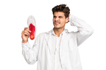 Young caucasian chiropodist man isolated touching back of head, thinking and making a choice.