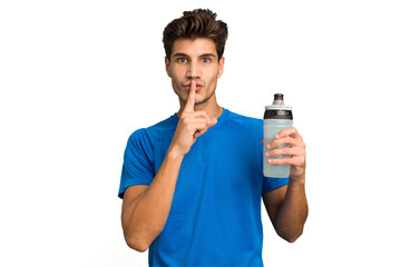 Young sport caucasian man holding a bottle of water isolated keeping a secret or asking for silence.