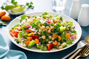 Tabbouleh salad. Tabouli salad with fresh parsley, onions, tomatoes, bulgur and chickpea. Healthy...