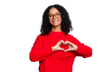 Young cute brazilian woman isolated smiling and showing a heart shape with hands.
