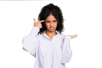 Young cute brazilian woman isolated showing a disappointment gesture with forefinger.