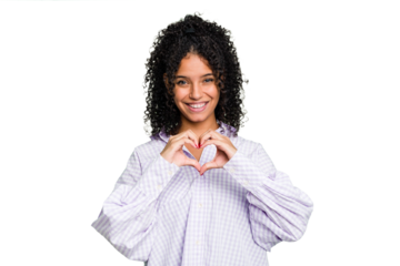 Young cute brazilian woman isolated smiling and showing a heart shape with hands.