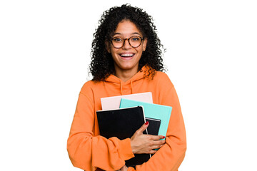 Young African american student woman holding a lot of books isolated - obrazy, fototapety, plakaty