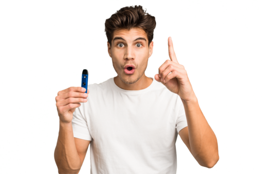 Young caucasian man holding an electronic cigarette isolated having an idea, inspiration concept.