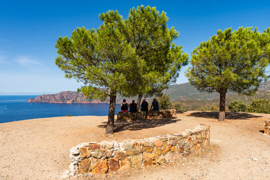 Tourists enjoy the view of the Gulf of Griolata, Corsica, France