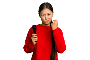 Young Chinese singer woman isolated showing fist to camera, aggressive facial expression.