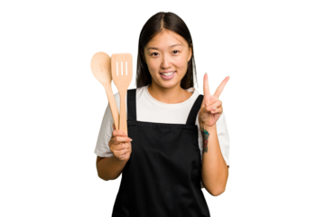 Young asian cook woman isolated showing number two with fingers.