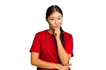 Young Asian woman isolated contemplating, planning a strategy, thinking about the way of a business.