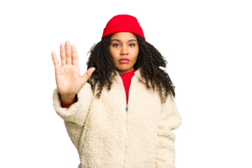 Young african american woman wearing winter clothes isolated standing with outstretched hand showing stop sign, preventing you.