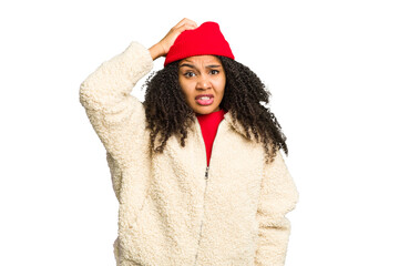 Young african american woman wearing winter clothes isolated being shocked, she has remembered...