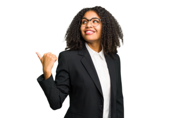Young african american business woman isolated points with thumb finger away, laughing and carefree.