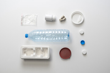 top view layout of plastic things, concept of nature care and plastic recycling