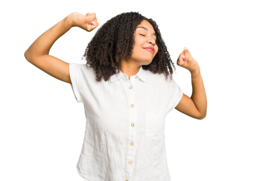 Young african american woman isolated stretching arms, relaxed position.