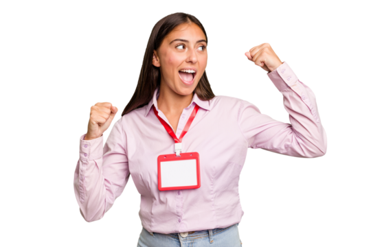 Young caucasian woman with a badge isolated raising fist after a victory, winner concept.