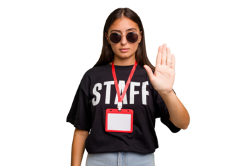 Young caucasian staff woman wearing a badge isolated standing with outstretched hand showing stop sign, preventing you.
