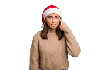 Young caucasian woman celebrating christmas wearing a santa hat isolated showing a disappointment gesture with forefinger.