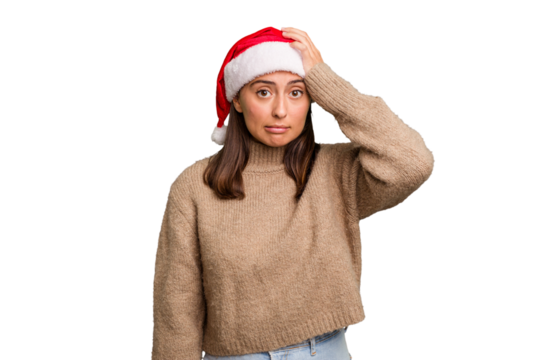 Young caucasian woman celebrating christmas wearing a santa hat isolated being shocked, she has remembered important meeting.