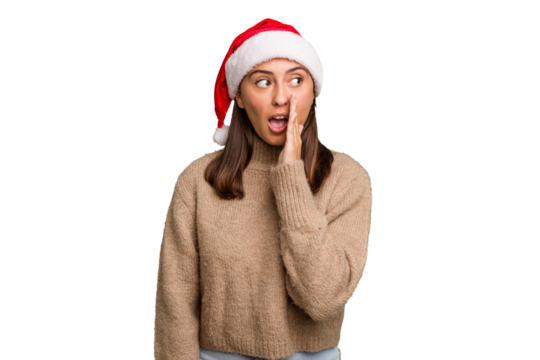 Young caucasian woman celebrating christmas wearing a santa hat isolated is saying a secret hot braking news and looking aside - Powered by Adobe