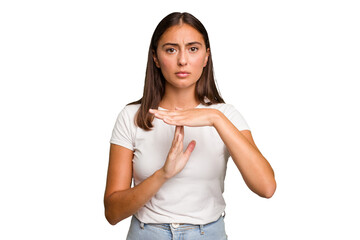 Young cute caucasian woman isolated showing a timeout gesture.