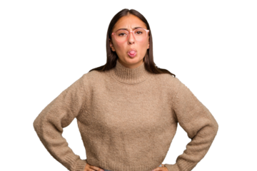 Young cute caucasian woman isolated funny and friendly sticking out tongue.