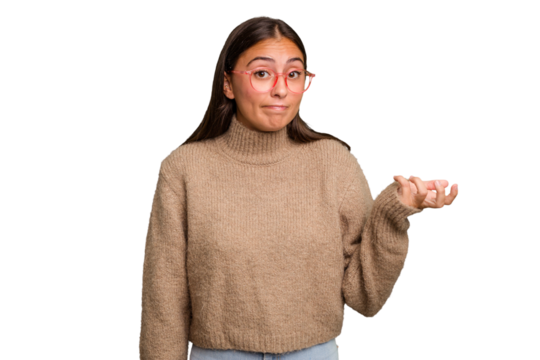 Young cute caucasian woman isolated doubting and shrugging shoulders in questioning gesture.