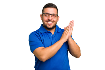 Young caucasian man isolated feeling energetic and comfortable, rubbing hands confident.