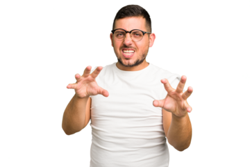 Young caucasian man isolated upset screaming with tense hands.