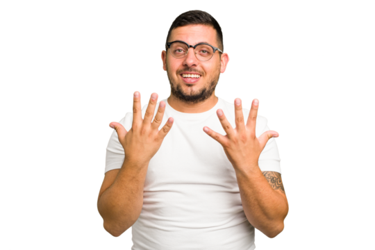 Young caucasian man isolated showing number ten with hands.