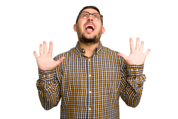 Young caucasian man isolated screaming to the sky, looking up, frustrated.