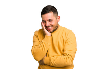 Fototapeta premium Young caucasian man isolated laughs happily and has fun keeping hands on stomach.