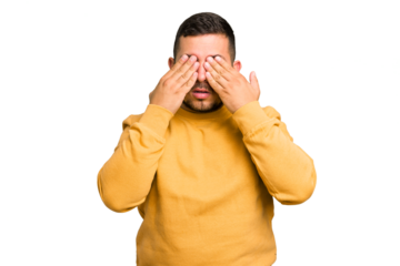 Young caucasian man isolated afraid covering eyes with hands.