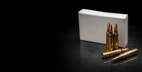 Bullet isolated on black background with reflexion. Rifle bullets close-up on black back....