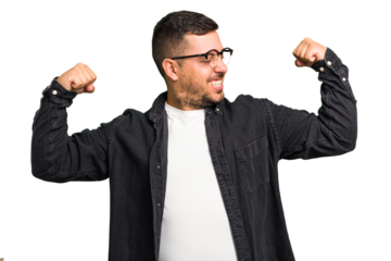 Young caucasian man isolated showing strength gesture with arms, symbol of feminine power