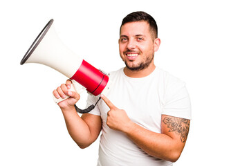 Young caucasian man holding a megaphone isolated