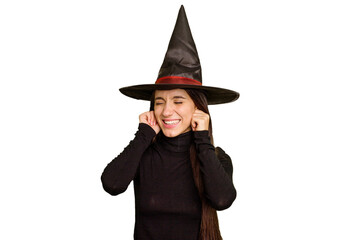 Young caucasian woman dressed as a witch for halloween day isolated covering ears with hands.