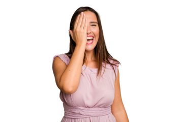 Young caucasian cute woman isolated having fun covering half of face with palm.