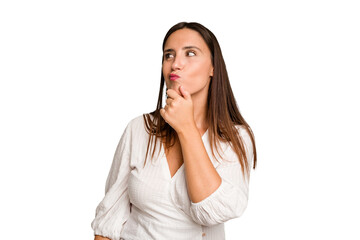 Fototapeta premium Young caucasian cute woman isolated relaxed thinking about something looking at a copy space.