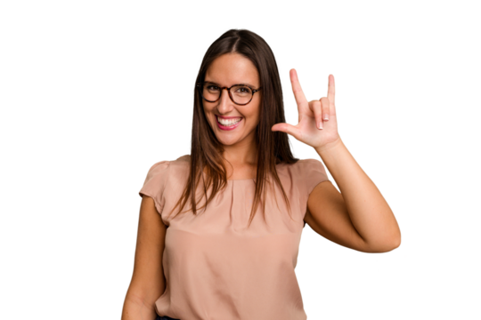 Young caucasian cute woman isolated showing a horns gesture as a revolution concept.