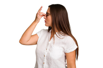 Young caucasian cute woman isolated having a head ache, touching front of the face.