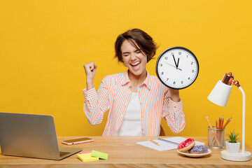 Young successful employee business woman wear shirt sit work at office desk with pc laptop hold in...