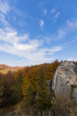 Fototapeta na wymiar Beautiful autumn landscapes. Colorful trees in autumn. Stone heritage of Ukraine. Tustan. Rock fortress