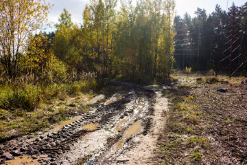 Dirty dirt road passing in the area of the clearing of electrical networks