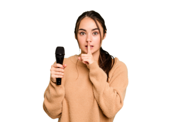 Young caucasian singer woman isolated on green chroma background keeping a secret or asking for silence.