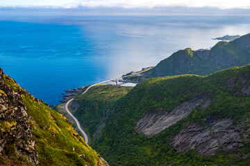 a panorama of the lofoten islands in northern norway from the top of the famous reinebringen trail, mighty mountains in a norwegian fjord, 